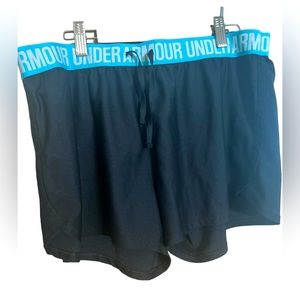 Under Armour women’s large black and teal shorts. Heat Gear, loose fit